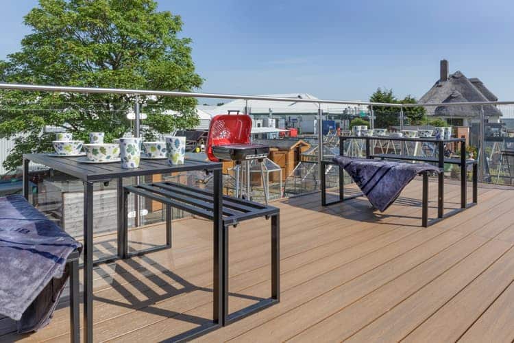 Garden room decking with tables